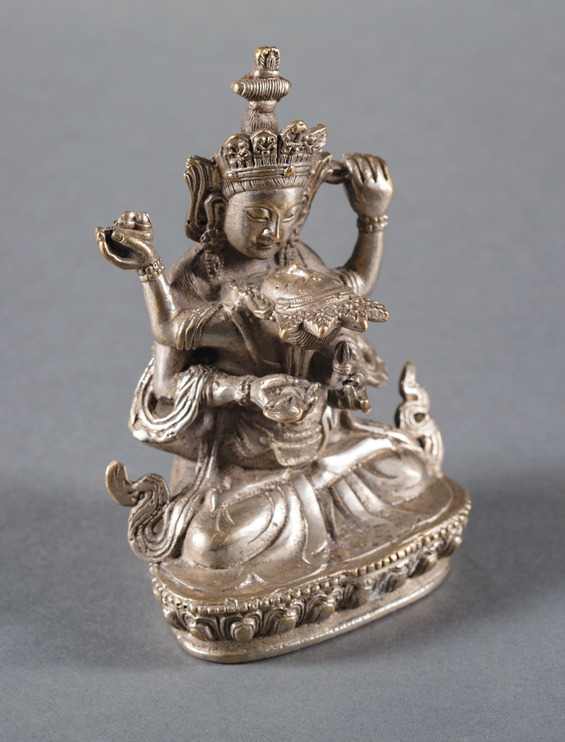 Tibetan Silvered Bronze Yabyum Group of Manjusri and Consort in Amorous Embrace , h. 4 3/8 in.