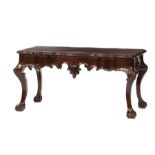 Portuguese Rococo-Style Mahogany Low Table , molded shaped top, scrolled apron, foliate knees,