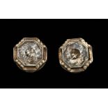 Pair of 14 kt. Yellow and White Gold and Diamond Stud Earrings , openwork bezels set with center