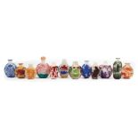 Twelve Chinese Color Overlay Glass Snuff Bottles , 19th/20th c., h. 2 in. to 3 in Provenance: Estate