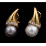 Pair of 18 kt. Yellow Gold, Pearl and Diamond Earrings , set with 1 white South Sea pearl, 1 black