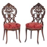 Pair of American Rococo Carved and Laminated Rosewood Slipper Chairs , mid-19th c., attr. to J. &