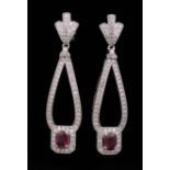 Pair of Platinum, Ruby and Diamond Dangle Earrings , drop with prong set oval cut rubies, total