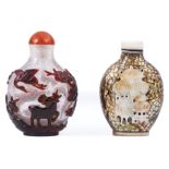 Two Chinese Snuff Bottles , incl. red overly bubble-suffused clear glass carved with deer and
