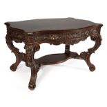 American Rococo Carved Mahogany Center Table , mid-19th c., molded turtle top, rocaille and acanthus