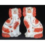 A pair of Staffordshire pottery seated Spaniel dogs, 22cm high