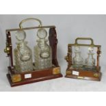 A mahogany and brass bound two bottle tantalus, stamped 'Betjemann's Patent', complete with a pair