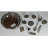 A small collection of assorted silver items comprising a pierced coaster with wooden base by