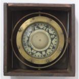 A gimbal compass by Kelvin White & Hutton of London, in brass case, suspended in stained wooden box