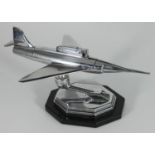 A novelty 'Jet Plane' chromium-plated table lighter, on ball and socket stand and elongated