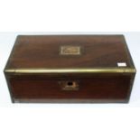 A Victorian coromandel writing slope, the hinged top with brass inlaid decoration, enclosing a