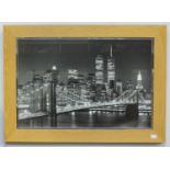 A monochrome print depicting the Manhattan skyline with the twin towers, in blonde elm frame, 50 x