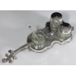 A silver-plated novelty four-piece condiment set, modelled as a violin