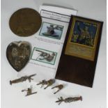 A small assortment of military collectables comprising a WWI memorial plaque or 'death penny'