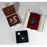Three boxed items of Swarovski glass including an SCS blue faceted love heart, a 10th Anniversary