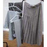 An Aquascutum beige and navy blue checked pleated long skirt, waist measures approx. 38cm,