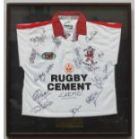 A Rugby Lions FC signed shirt, sixteen signatures, Rugby Cement sponsor on Gilbert shirt, glazed and