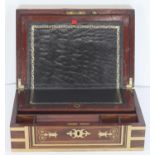 An early 19th century brass-bound and inlaid mahogany writing slope, the interior with gilt-tooled