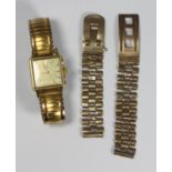 A ladies gold-plated Omega wristwatch, the gilt square dial with batons denoting hours, on expanding