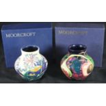 A small Moorcroft pottery vase of inverted baluster form and decorated in the 'Queen's Choice'