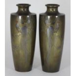 A pair of Japanese bronze vases of tapering cylindrical form, each inlaid with copper, gold and