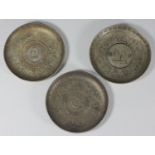 Three Chinese white metal Zodiac bowls, inset with coins including 1908 & 1934 examples, 9.5cm diam