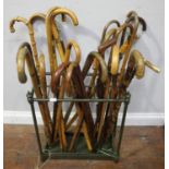 A Victorian brass twelve section umbrella / walking stick stand with baluster finials and