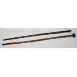 A bamboo sword stick / walking stick with metal mounts and flattened circular knop, overall length