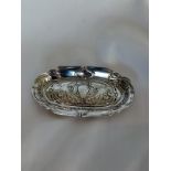 An art nouveau silver oval pin tray, embossed with peacocks and floral whiplash decoration,