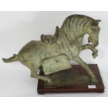 A 20th century Chinese bronze figure of a Tang burial horse, on hardwood plinth 33x44cm