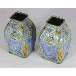 A pair of Royal Doulton Lambeth secessionist / art nouveau vases, of square baluster form, decorated