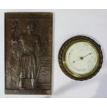 An early 20th century circular aneroid barometer in rope-twist circular carved frame, 28cm diam,