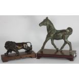 A bronze figure of a trotting horse, on fitted wooden plinth, approx. 17cm high, together with a