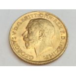 King George V sovereign, 1914, obv bare head, rv George & Dragon, weight 8.0g, condition VF.