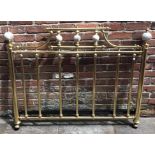 A brass double bed frame on castors, with base, 140cm wide