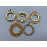 Four 9ct gold sovereign mounts and a 9ct gold half sovereign mount, 16.90g