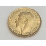 King George V sovereign, 1911, obv bare head, rv George & Dragon, weight 8.0g, condition VF.