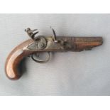 An early 18th century flintlock pocket pistol, half-round / half octagonal 4-inch steel barrel,