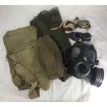 A British military chemical gas mask, together with canvas bag, cleaning clothes, scrim, WW2 army