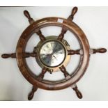 A Chadburns of Liverpool & London clock, modelled as a brass bulkhead within a 6-spoke ships