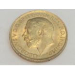 King George V sovereign, 1911, obv bare head, rv George & Dragon, weight 8.0g, condition VF.