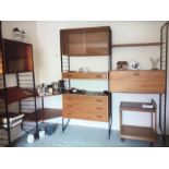 A Robert Heal for Staples mid-century Ladderax teak wood modular wall unit comprising five black