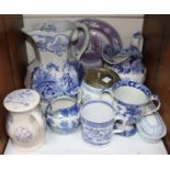 SECTION 27. A quantity of blue and white pottery including a large jug depicting a girl on a