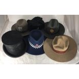 A New Zealand Police furfelt hat together with a Stratton Chicago Sheriff's hat, black Top Hat by