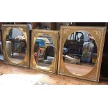 Three assorted oval mirrors, each in similar rectangular gilt frames with relief moulded, floral and