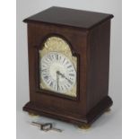 A mahogany cased Silver Jubilee mantel clock by Charles Frodsham, with silver gilt arch depicting