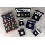 A collection of assorted proof coins including a cased 2005 silver proof four-coin set, a 1982 proof