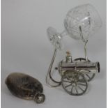 A silver-plated brandy warmer modelled as a cannon, with glass brandy balloon, together with a