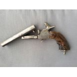 A mid-19th century double-barrel breech-loading pin-fire pistol, with 4.5 inch hinged side-by-side