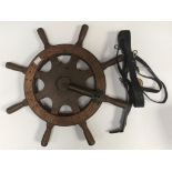 An eight spoke yacht/boat wheel, the central metal plate inscribed 'Registered in Great Britain